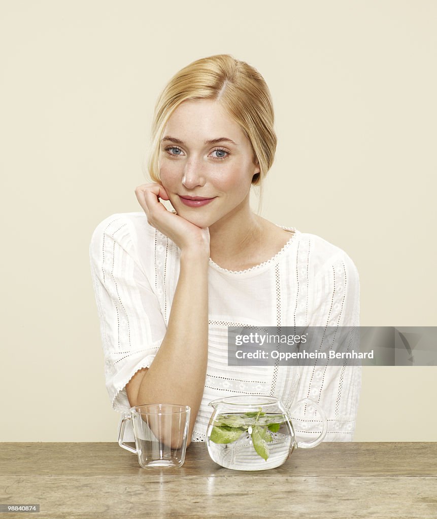 Female smiling with fresh brewing tea