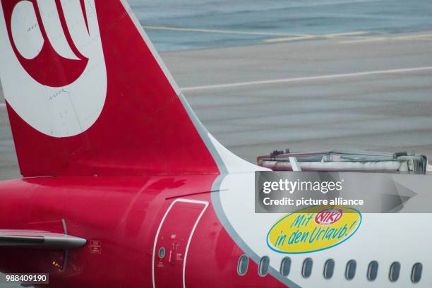 Plane of the airline Air Berlin with a sticker reading 'Mit Niki in den Urlaub' can be seen at the airport in Duesseldorf, Germany, 1 December 2017....