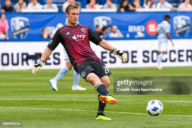 Sporting Kansas City goalkeeper Tim Melia kicks the ball during the Sporting Kansas City versus the Montreal Impact game on June 30 at Stade Saputo...