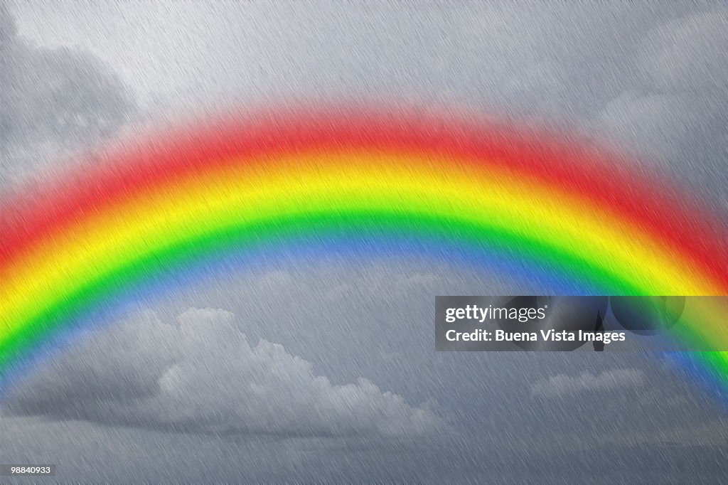 Rainbow in rainy sky