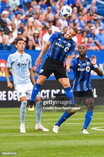 Montreal Impact midfielder Samuel Piette hits the ball with his head while jumping during the Sporting Kansas City versus the Montreal Impact game on...