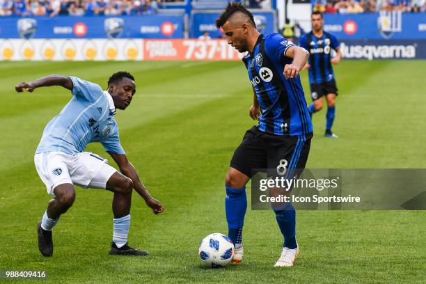 Sporting Kansas City forward Gerso Fernandes tries to tackle Montreal Impact midfielder Saphir Taider during the Sporting Kansas City versus the...