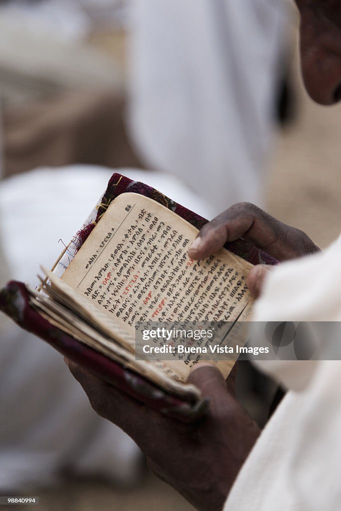 Man reading Bible in Amharic