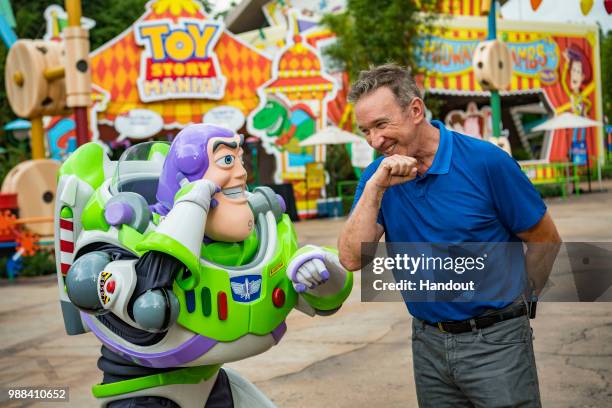 In this handout image provided by Walt Disney World Resort, actor Tim Allen and Buzz Lightyear calls Star Command, during a special preview of Toy...