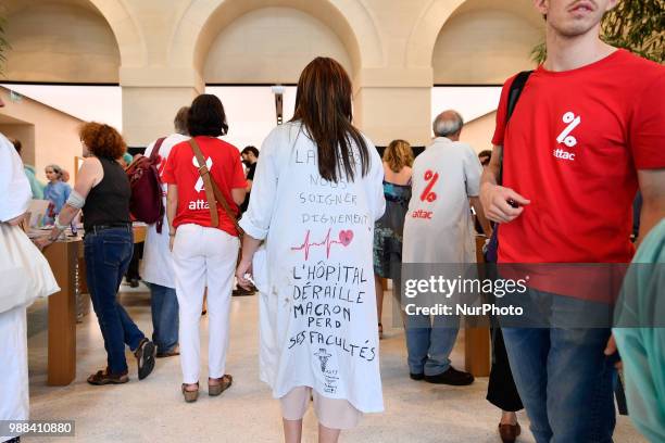 More than 100 Attac activists entered the Apple Store in Saint-Germain near Paris, France, on 30 June 2018 and set up a hospital. The objective, to...