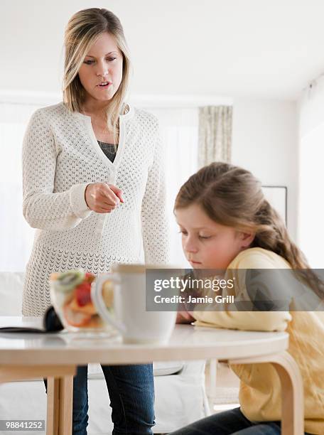 mother scolding daughter - mother scolding stock pictures, royalty-free photos & images