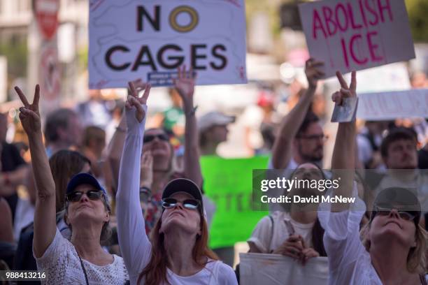 People call out words of encouragement to detainees held inside the Metropolitan Detention Center after marching to decry Trump administration...