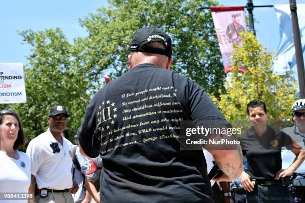 Officers with the Philadelphia Police Dept. Civil Affairs unit remove an unnamed individual from the crowd as thousands participate in a rally to...