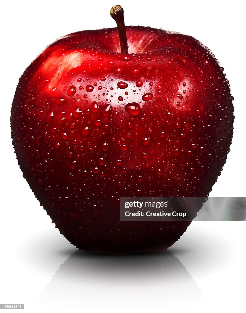 Red apple with water droplets