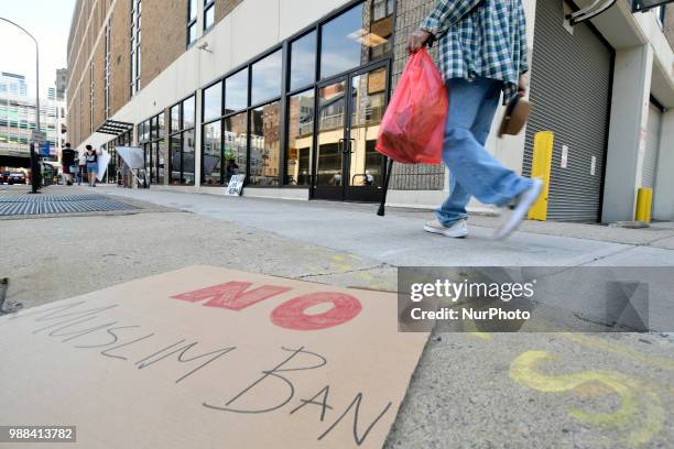 Sign that reads No Muslim Ban is left after a group of protestors rallied at a local Dept of Homeland Security Immigration Field Office, in...