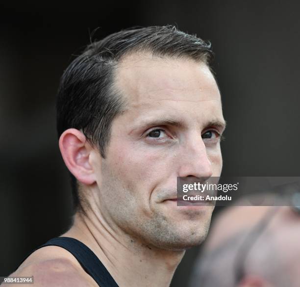 Renaud Lavillenie of France gestures before the Men's pole vault competition at the IAAF Diamond League meeting at the Stade Charlety in Paris,...