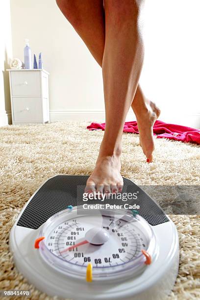 weighing scales in bathroom - cade stock-fotos und bilder