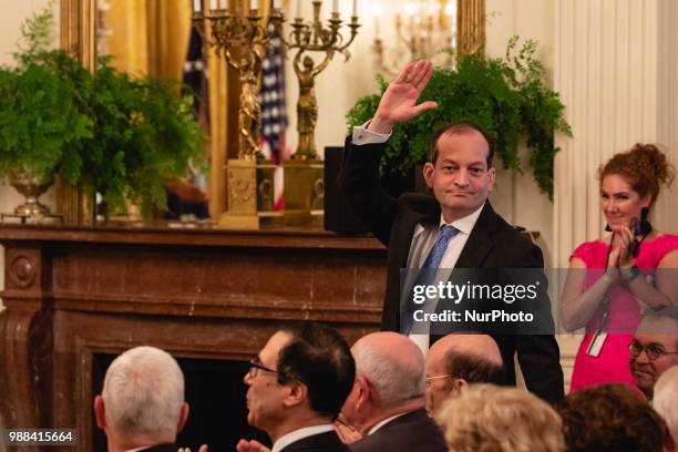 President Donald Trump acknowledges R. Alexander Acosta, Secretary of Labor, during his event celebrating the Republican tax cut plan in the East...