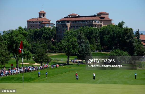 Fred Couples makes an approach shot on the first hole during round three of the U.S. Senior Open Championship at The Broadmoor Golf Club on June 30,...