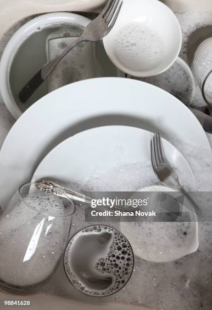 dishes in sink - shana novak stockfoto's en -beelden