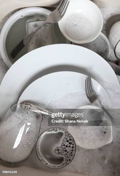 dishes in sink - drenched stock pictures, royalty-free photos & images