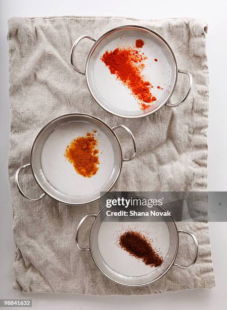 fresh ground spices in soup on linen towel. - shana novak stockfoto's en -beelden