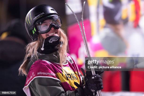 Giulia Tanno of Switzerland smiles as she arrives at the finishing line in the women's finals of the Big Air Freestyle Skiing World Cup at the...