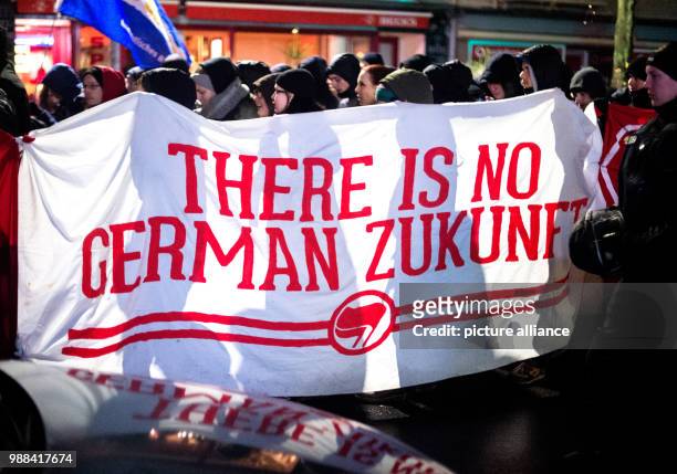Demonstrators protest with a sign reading "There is no german Zukunft" against the Alternative for Germany party conference, which is due to take...