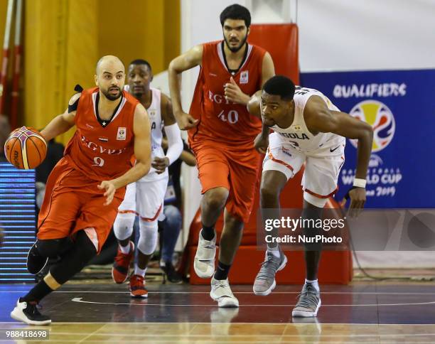 Ahmed Aboelela Moursi Khalaf and Ibrahim Ragab Elgammal of Egypt in action against Jaques Leandro P. Nzadi Conceicao of Angola during 2019 World Cup...