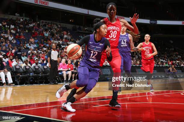 Briann January of the Phoenix Mercury handles the ball against the Washington Mystics on June 30, 2018 at the Verizon Center in Washington, DC. NOTE...