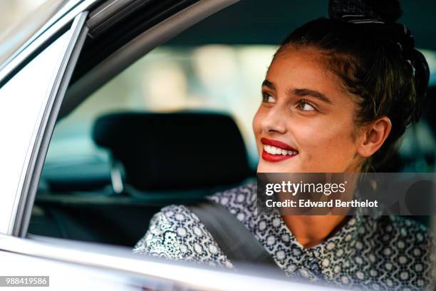 Taylor Hill is seen, during the Miu Miu Cruise Collection show, outside the Hotel Regina, in Paris, on June 30, 2018 in Paris, France.
