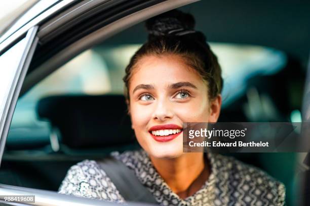 Taylor Hill is seen, during the Miu Miu Cruise Collection show, outside the Hotel Regina, in Paris, on June 30, 2018 in Paris, France.