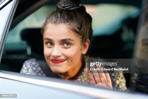 Taylor Hill is seen, during the Miu Miu Cruise Collection show, outside the Hotel Regina, in Paris, on June 30, 2018 in Paris, France.