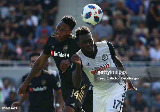 Sapong of Philadelphia Union and Mark-Anthony Kaye of Los Angeles FC vie for the ball in the first half during the MLS match at Banc of California...