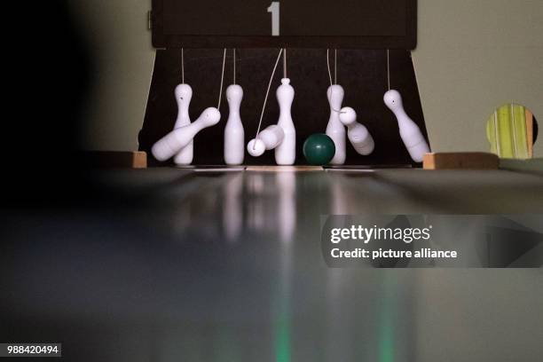 Bowling ball hits the pins of a fully automated bowling alley at the bowling centre in Bovenden, Germany, 1 December 2017. Bowling used to be popular...
