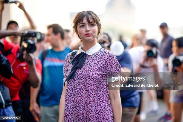 Ana de Armas wears a pink floral print dress, outside the Miu Miu Cruise Collection show, outside the Hotel Regina, in Paris, on June 30, 2018 in...