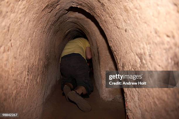 man crawling through cu chi tunnel - viet cong stock pictures, royalty-free photos & images