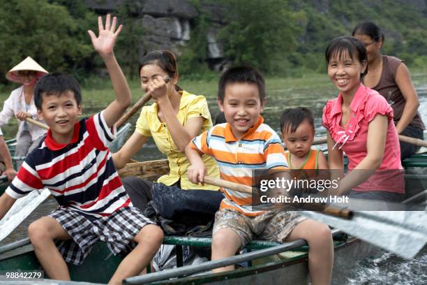 people on boats, ngo dong river, tam coc, vietnam - dong tam stock pictures, royalty-free photos & images