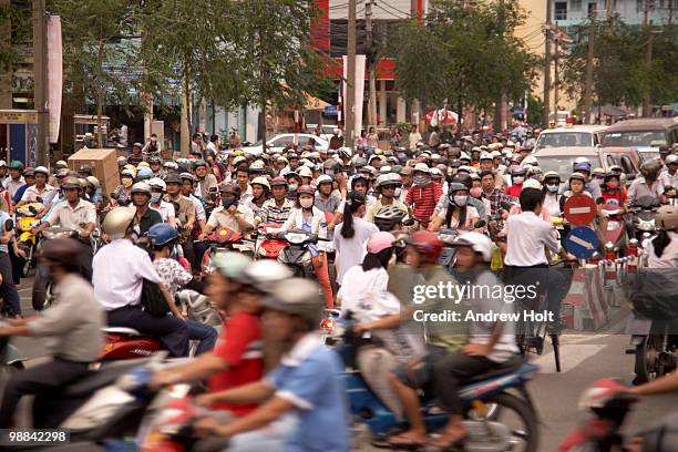melee of motorbikes or scooters, saigon, vietnam - ho chi minh city stock-fotos und bilder