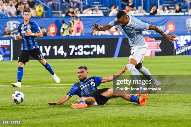 Montreal Impact defender Rudy Camacho falls on the ground after stopping a shot from Sporting Kansas City forward Khiry Shelton during the Sporting...