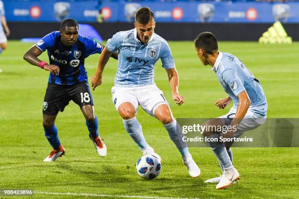 Sporting Kansas City midfielder Yohan Croizet runs in control of the ball during the Sporting Kansas City versus the Montreal Impact game on June 30...