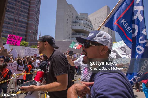 Pro-Trump counter demonstrators argue with protesters decrying Trump administration immigration and refugee policies on June 30, 2018 in Los Angeles,...