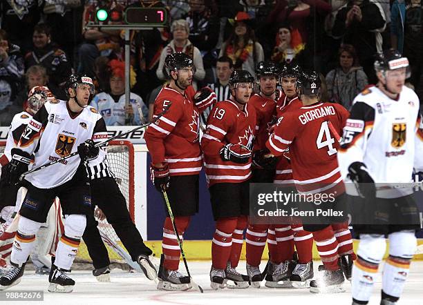 Steven Stamkos of Canada celebrates with his team mates after scoring his team's fourth goal during the pre IIHF World Championship match between...