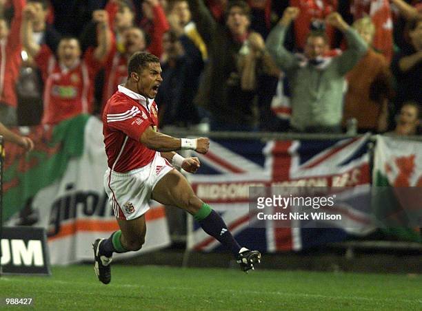 Jason Robinson of the British and Irish Lions scores the first try against Australia during the First Test Match between the British and Irish Lions...