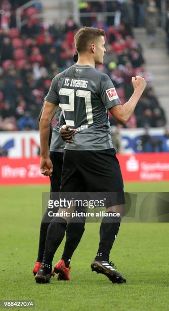 Augsburg's Alfred Finnbogason celebrates his 2-0 goal with team mate Francisco da Silva Caiuby during the German Bundesliga football match between...