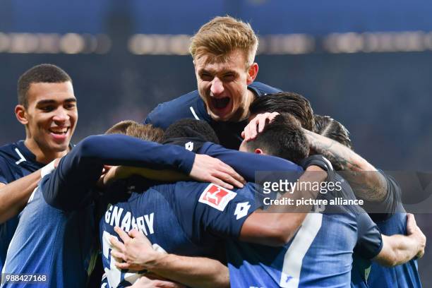 Hoffenheim's Stefan Posch and Hoffenheim's Kevin Akpoguma celebrate with teammates after the goal for 2:0 during the German Bundesliga football match...