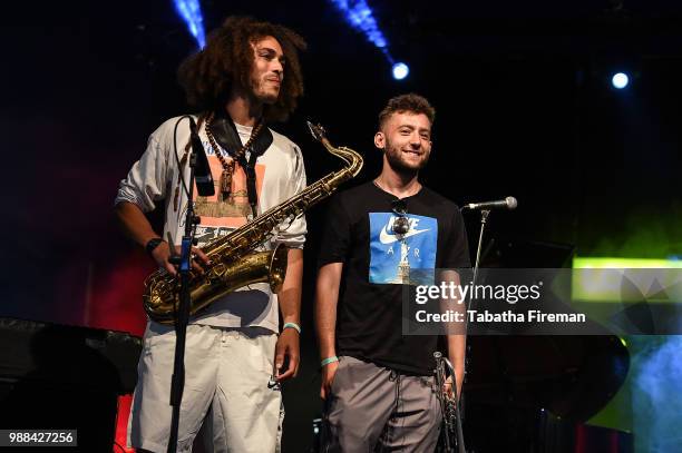 James Mollison and Dylan Jones of Ezra Collective perform on the Arena stage on Day 2 of Love Supreme Festival on June 30, 2018 in Brighton, England.