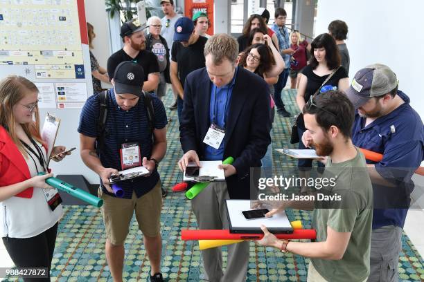 The Make Music Day Parade of Bell Ringers perform walking through the crowd of attendees during The Make Music Experience at Summer NAMM on June 30,...
