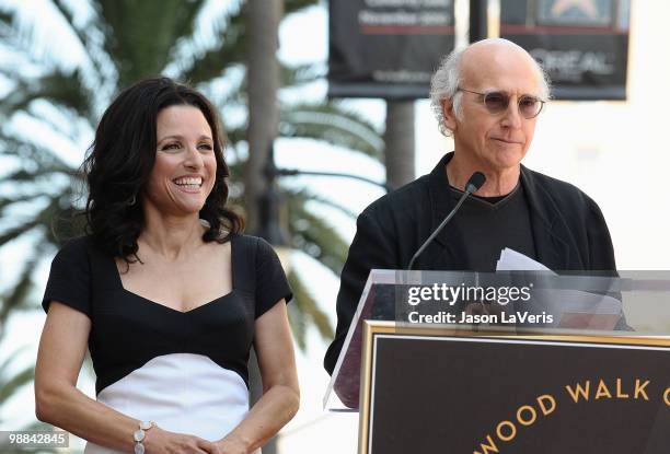 Julia Louis-Dreyfus and Larry David attend Julia Louis-Dreyfus' induction into the Hollywood Walk of Fame on May 4, 2010 in Hollywood, California.