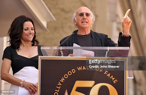 Actress Julia Louis-Dreyfus listens to Actor/Director Larry David speak at her Hollywood Walk of Fame Star ceremony on May 4, 2010 in Hollywood,...