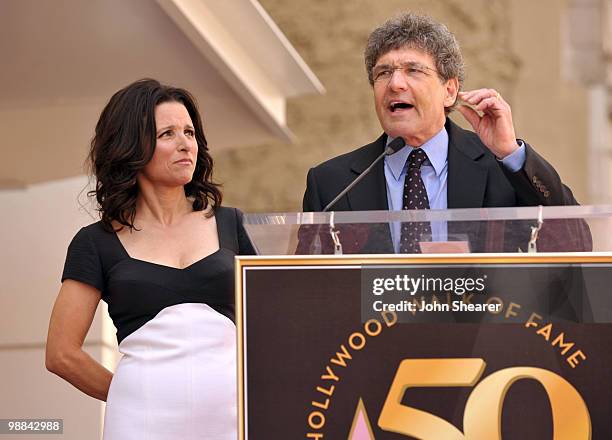 Actress Julia Louis-Dreyfus listens to Warner Bros President Alan Horn speak at her Hollywood Walk of Fame Star ceremony on May 4, 2010 in Hollywood,...