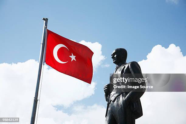 turkish flag and ataturk statue in kas, turkey - bandera turca fotografías e imágenes de stock
