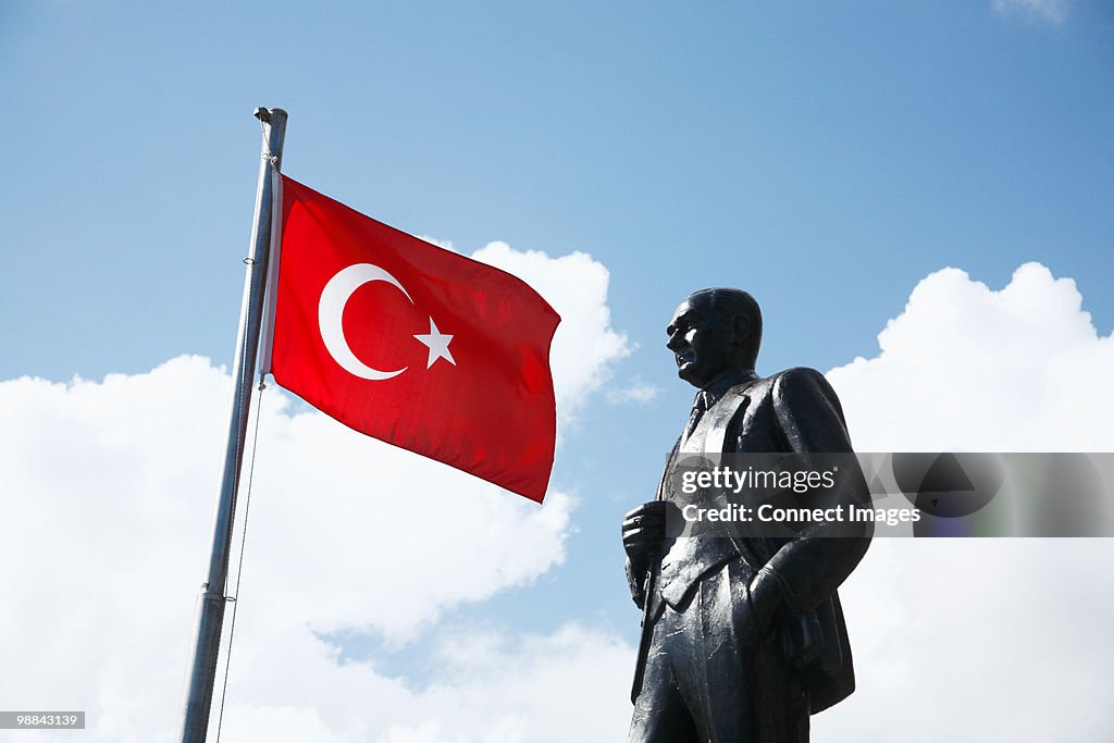 Turkish flag and ataturk statue in kas, turkey