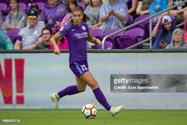Orlando Pride forward Alex Morgan looks to pass the ball during the soccer match between the Orlando Pride and the NC Courage on June 30, 2018 at...