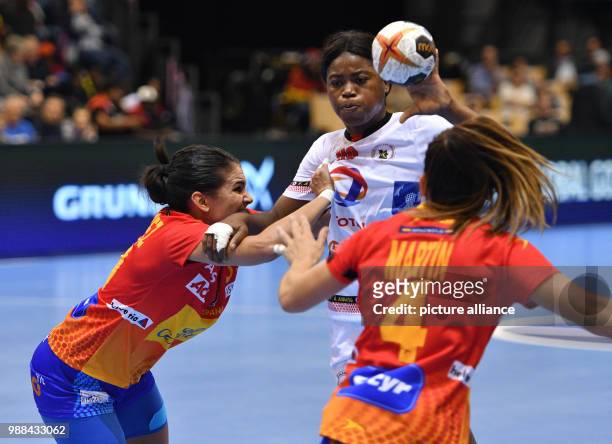 Angola's Isabel Evelize Guialo in action against Spain's Maria Nunez Nistal and Manuela Correia Paulino during the women's handball world...